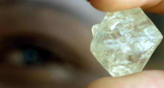 a-worker-sorts-rough-diamonds-in-gaborone