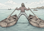 Fisherman standing straddling two wooden fishing boats named Sea Venture and Harvester on choppy sea waters
